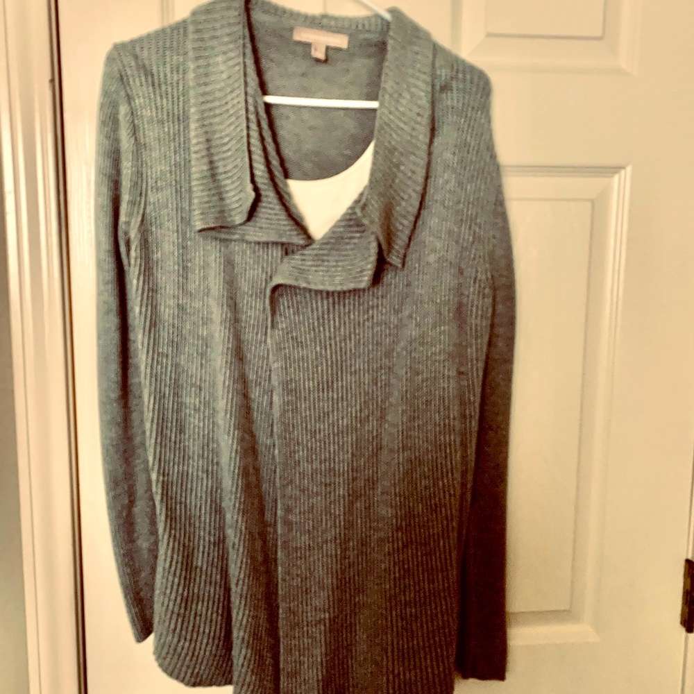 Unusual sweater compliments any body type. Stylish accents & figure flattering.